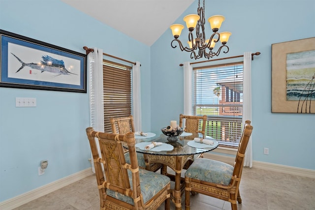 dining space with vaulted ceiling, light tile patterned floors, a notable chandelier, and baseboards