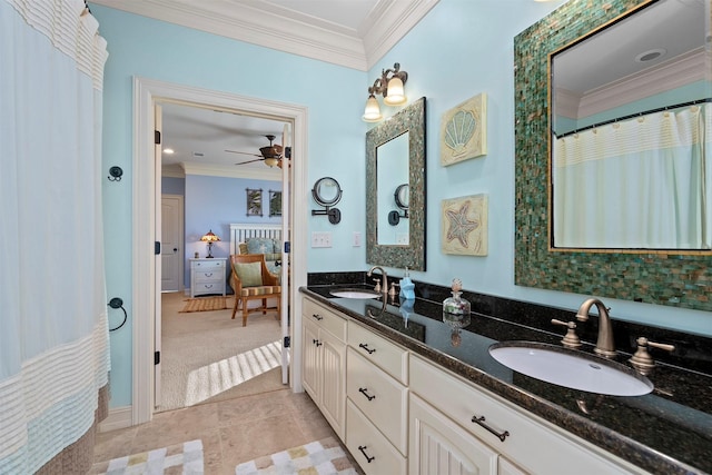 ensuite bathroom with ornamental molding, a sink, ensuite bath, and double vanity