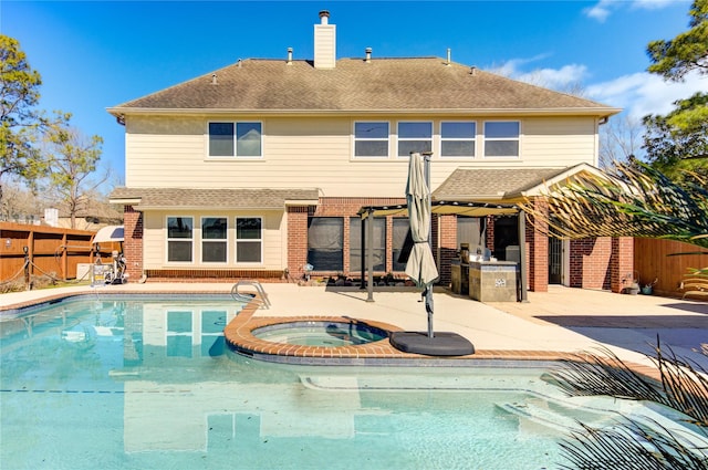 view of swimming pool featuring a fenced backyard, an in ground hot tub, a patio, and a fenced in pool