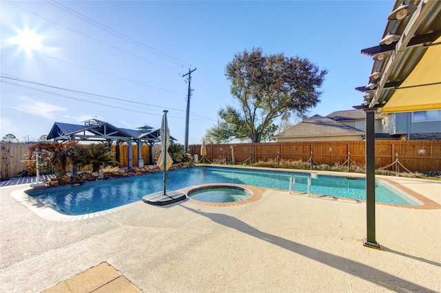 view of swimming pool featuring a patio area, an in ground hot tub, a fenced backyard, and a fenced in pool