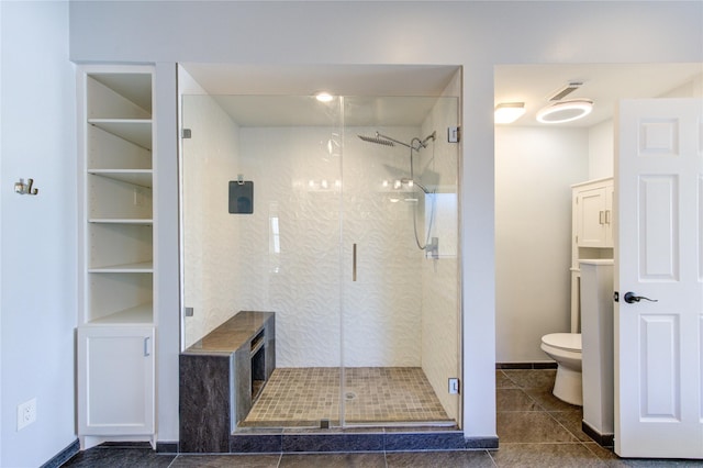 full bathroom featuring a stall shower, tile patterned floors, toilet, and visible vents