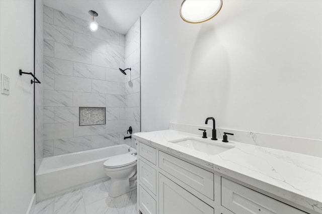 full bathroom featuring marble finish floor, bathing tub / shower combination, vanity, and toilet