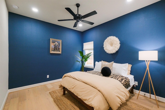 bedroom with a ceiling fan, recessed lighting, baseboards, and wood finished floors