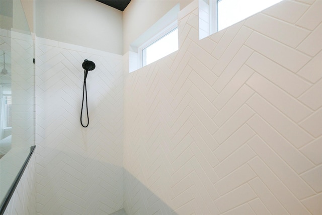 full bathroom with tiled shower