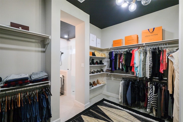 walk in closet with tile patterned floors