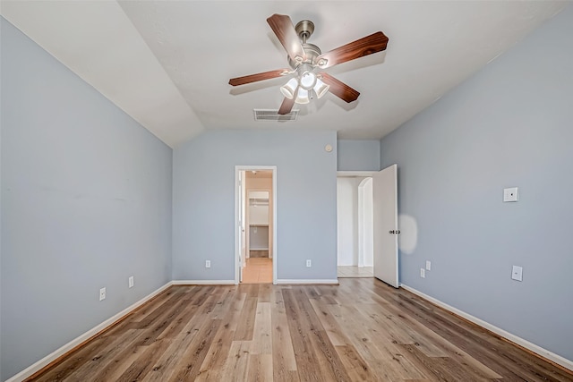 unfurnished bedroom with ceiling fan, light wood finished floors, visible vents, and baseboards