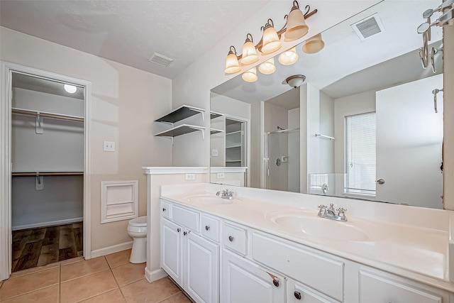 full bath featuring a sink, visible vents, and tile patterned floors