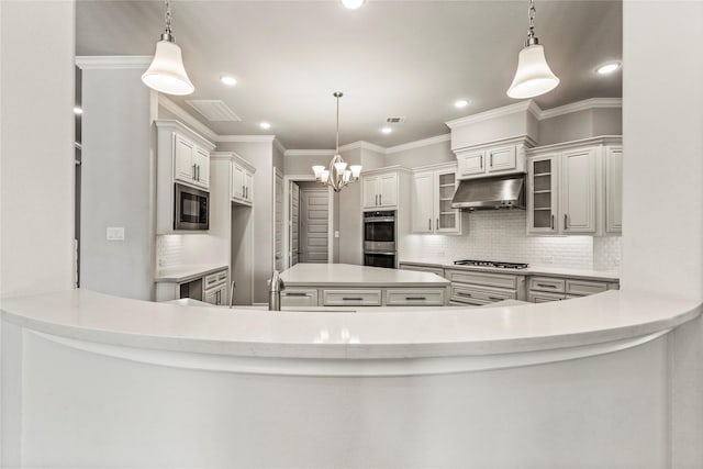 kitchen with ornamental molding, built in microwave, stainless steel double oven, under cabinet range hood, and gas cooktop