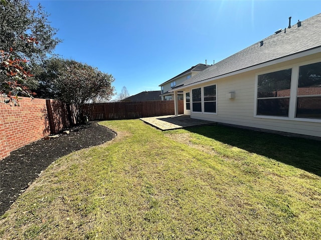 view of yard featuring a patio area and a fenced backyard