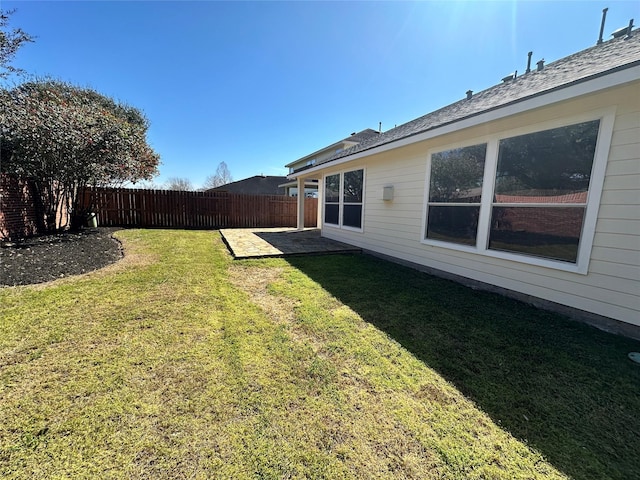 view of yard with a patio area and a fenced backyard