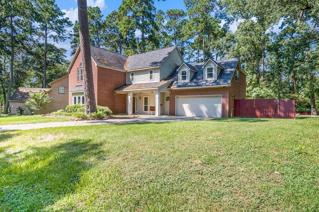 view of front facade featuring brick siding, an attached garage, fence, driveway, and a front lawn