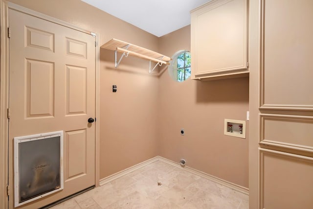 washroom featuring hookup for a washing machine, cabinet space, electric dryer hookup, and baseboards