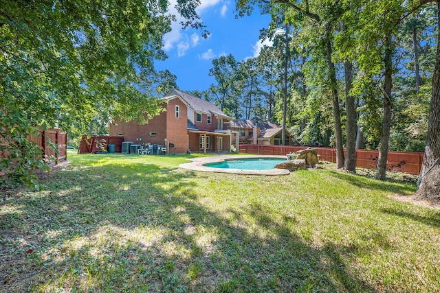 view of yard featuring a fenced in pool and a fenced backyard