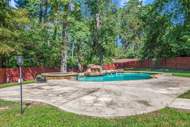 view of swimming pool featuring a patio area, a fenced backyard, a fenced in pool, and an in ground hot tub