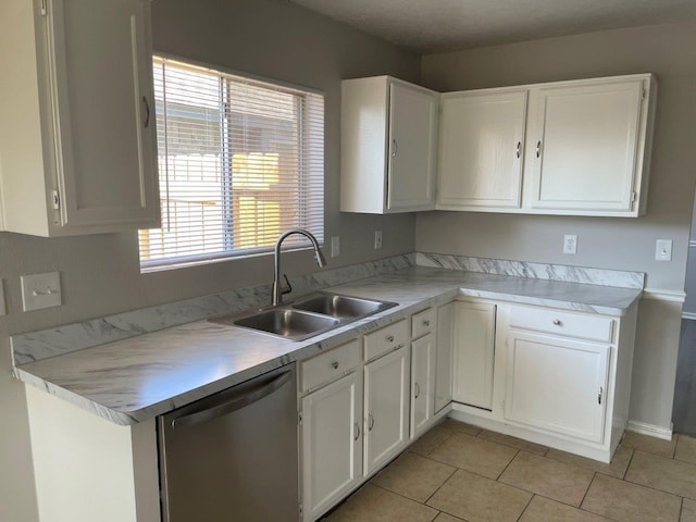 kitchen featuring a sink, white cabinetry, light countertops, and dishwasher