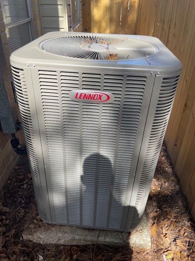 exterior details featuring central AC unit and a jacuzzi