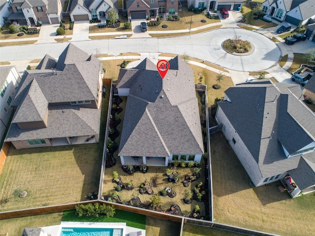 birds eye view of property with a residential view