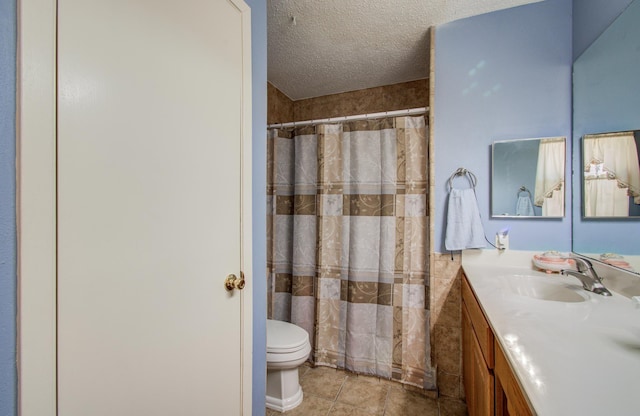 full bathroom with a shower with shower curtain, toilet, a textured ceiling, vanity, and tile patterned floors