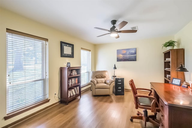 office with wood finished floors, visible vents, and a ceiling fan