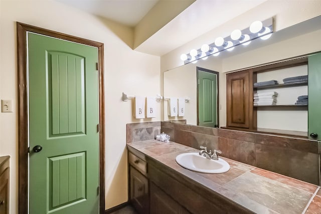 bathroom with decorative backsplash and vanity