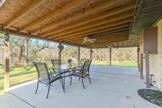 view of patio featuring ceiling fan and outdoor dining area