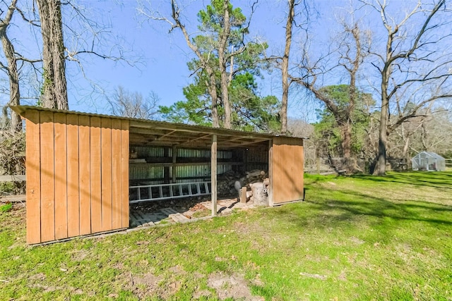 view of pole building with a yard