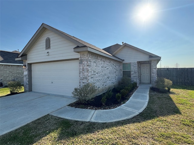 ranch-style house with concrete driveway, an attached garage, fence, a front lawn, and brick siding