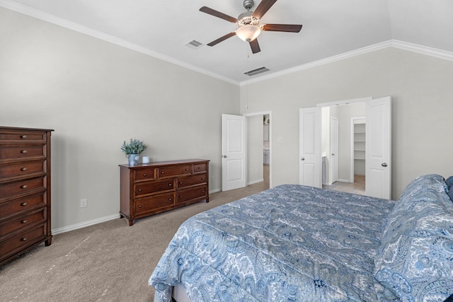 bedroom with lofted ceiling, carpet floors, ornamental molding, and visible vents