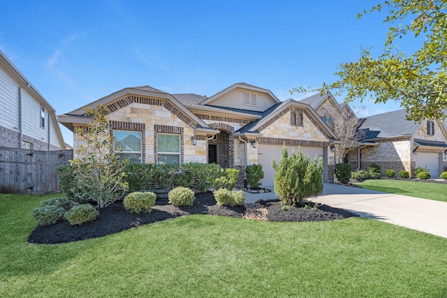 french country home with an attached garage, a front yard, fence, stone siding, and driveway