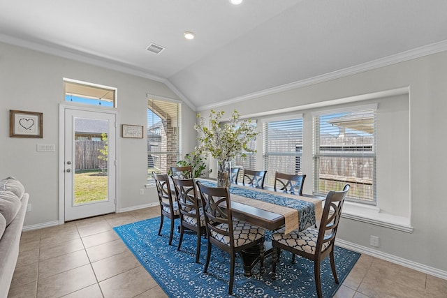 dining room with ornamental molding, a wealth of natural light, visible vents, and lofted ceiling