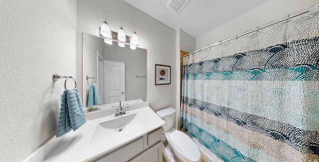 full bathroom featuring visible vents, a textured wall, toilet, curtained shower, and vanity