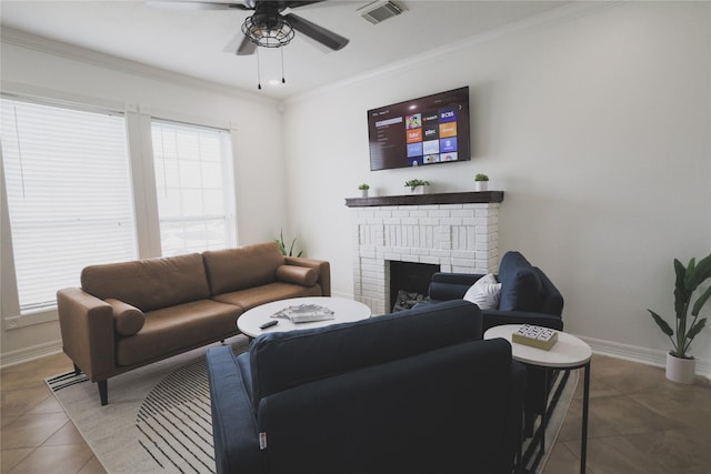 living area with a fireplace, visible vents, ornamental molding, baseboards, and tile patterned floors