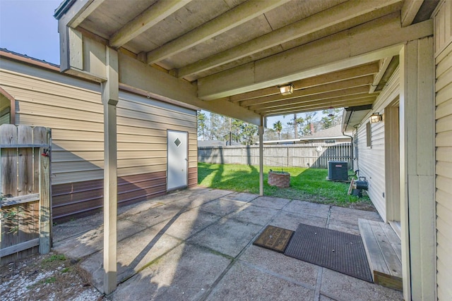 view of patio featuring central AC and fence