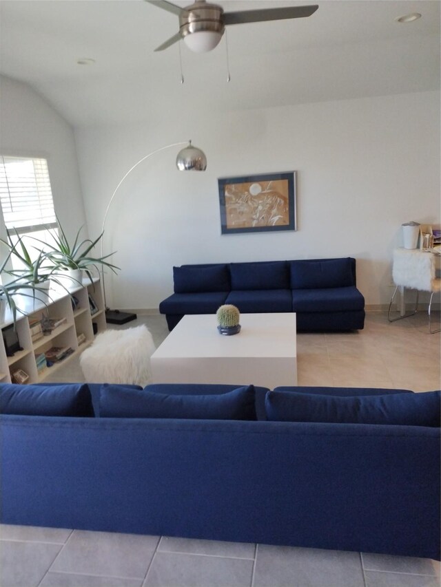 living room with tile patterned flooring and ceiling fan
