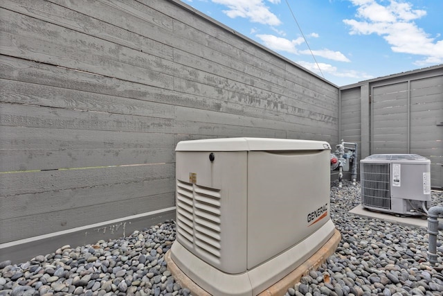 exterior details featuring cooling unit, fence, and a power unit