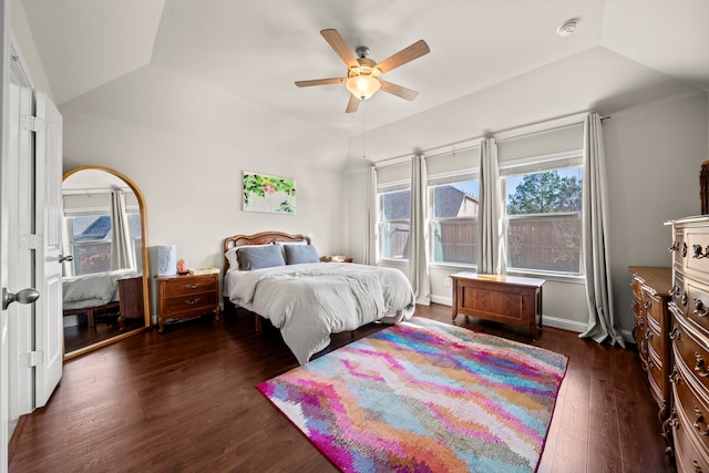 bedroom featuring a ceiling fan, dark wood finished floors, and vaulted ceiling