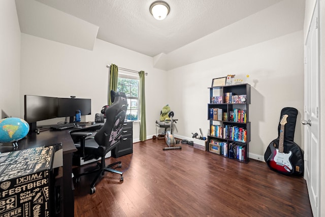 office area featuring a textured ceiling, wood finished floors, and baseboards