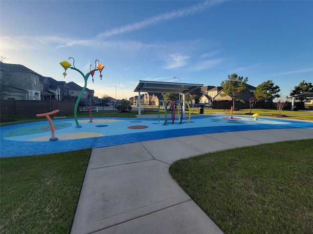 view of community with playground community and a lawn