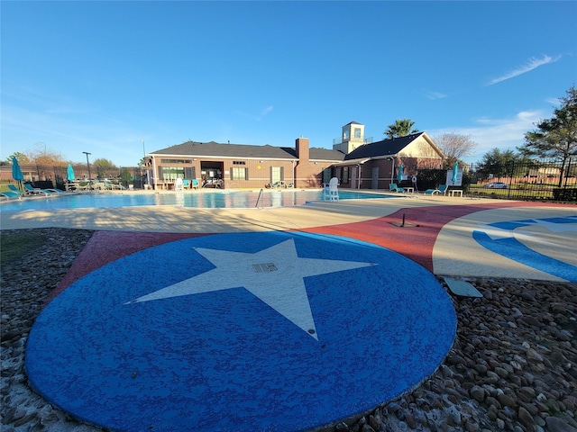 surrounding community featuring a patio area, fence, and a pool