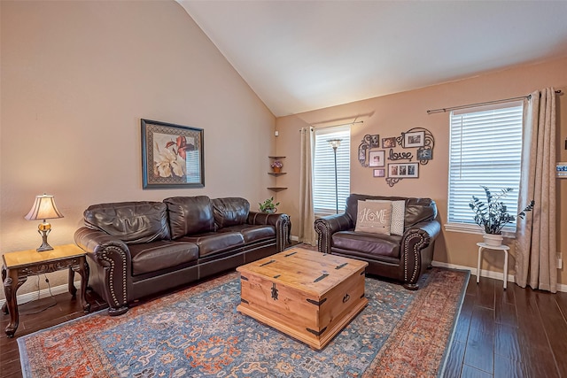 306 Marion St, Brazoria, TX 77422 - living area featuring lofted ceiling, dark wood-style floors, and baseboards