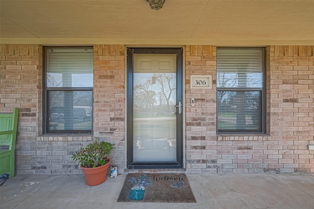 306 Marion St, Brazoria, TX 77422 - view of exterior entry with brick siding and covered porch