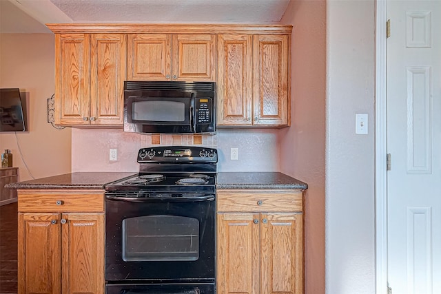 306 Marion St, Brazoria, TX 77422 - kitchen with black appliances, decorative backsplash, and dark stone countertops