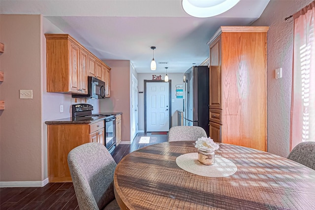 306 Marion St, Brazoria, TX 77422 - dining space with dark wood-style flooring, baseboards, and a textured wall