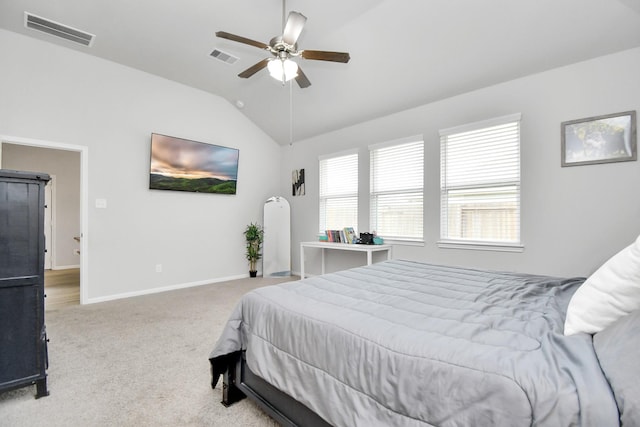 carpeted bedroom with ceiling fan, baseboards, visible vents, and vaulted ceiling