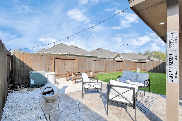 view of patio / terrace featuring outdoor lounge area and a fenced backyard