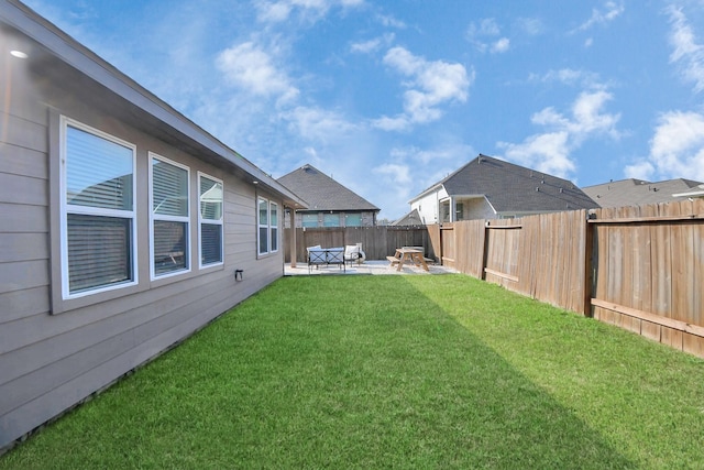 view of yard with a patio and a fenced backyard