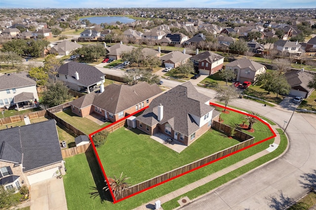 bird's eye view with a residential view and a water view