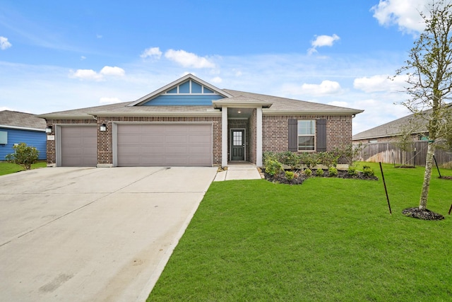 view of front of home with an attached garage, brick siding, fence, driveway, and a front yard