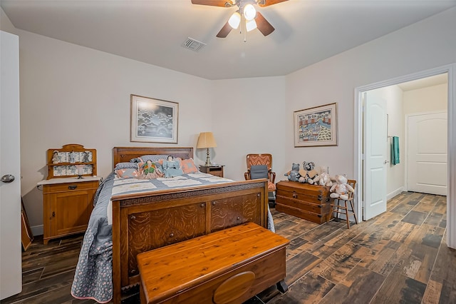 bedroom featuring a ceiling fan, visible vents, dark wood finished floors, and baseboards