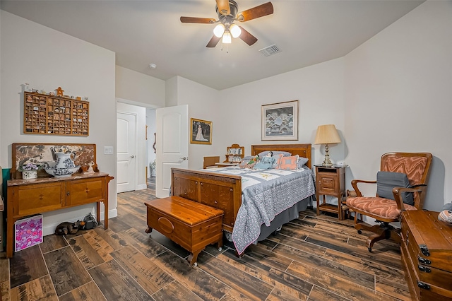 bedroom with visible vents, a ceiling fan, and wood finish floors